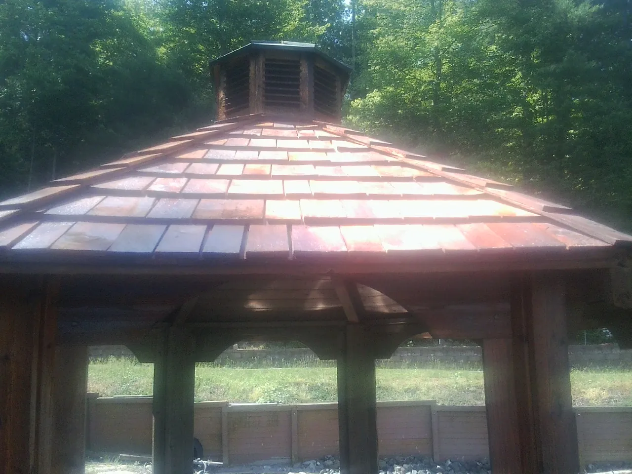 New cedar shake roof and cupola on a lakeside gazebo in White City